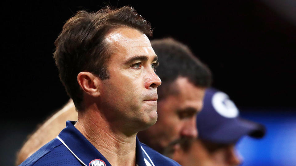 Pictured here, Geelong coach Chris Scott is happy to do what he's told about COVID-19.