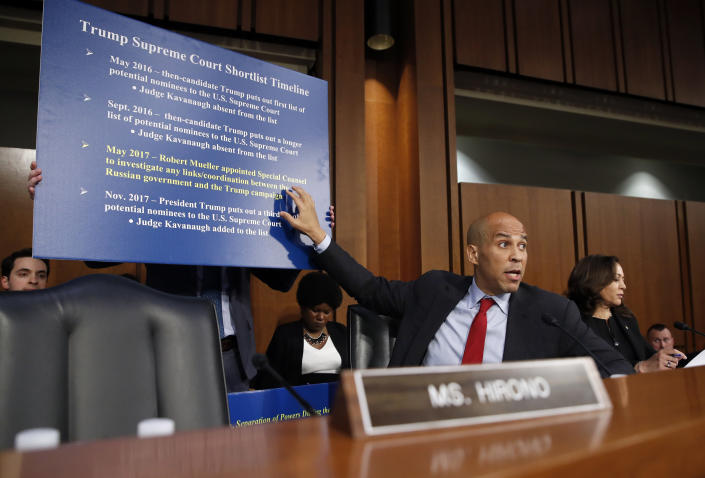 <p>Sen. Cory Booker, D-N.J., gestures as he questions President Donald Trump’s Supreme Court nominee, Brett Kavanaugh, foreground, as he testifies before the Senate Judiciary Committee on Capitol Hill in Washington, Thursday, Sept. 6, 2018, for the third day of his confirmation hearing to replace retired Justice Anthony Kennedy. (Photo: Alex Brandon/AP) </p>