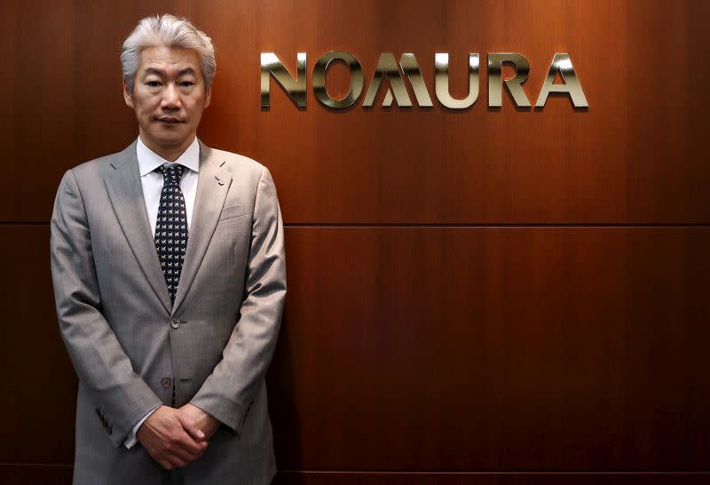 FILE PHOTO: Nomura Holdings' Chief Executive Officer Nagai poses for pictures after an interview with Reuters in Tokyo