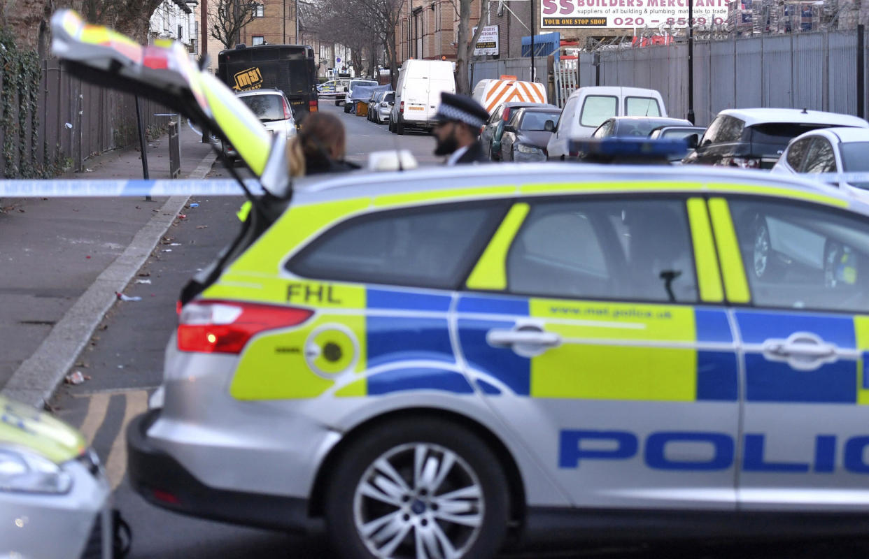 The scene where an unidentified 14-year-old boy died late Tuesday after he was found with stab injuries, in the Waltham Forest area of north-east London, England, Wednesday Jan. 9, 2019.   The recent rise in knife crime has prompted London Mayor Sadiq Khan to call to for a task force to address violent crime. (John Stillwell/PA via AP)