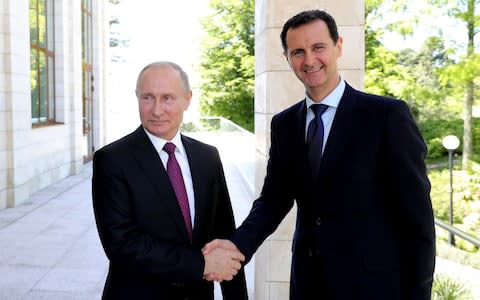 Israel hopes that Vladimir Putin (left) and Bashar al-Assad will lose patience with Iran  - Credit: MIKHAIL KLIMENTYEV/AFP/Getty Images