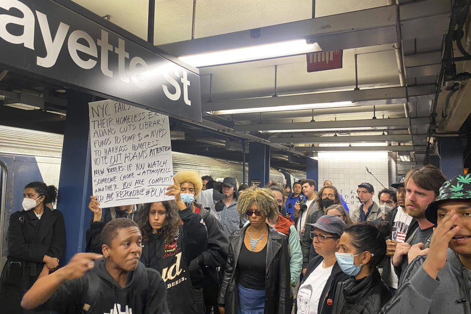 Protesters march through the Broadway-Lafayette subway station  to protest the death of Jordan Neely, Wednesday afternoon, May 3, 2023 in New York. Four people were arrested, police said. Neely, a man who was suffering an apparent mental health episode aboard a New York City subway, died this week after being placed in a headlock by a fellow rider on Monday, May 1, according to police officials and video of the encounter. (Jake Offenhartz / AP)