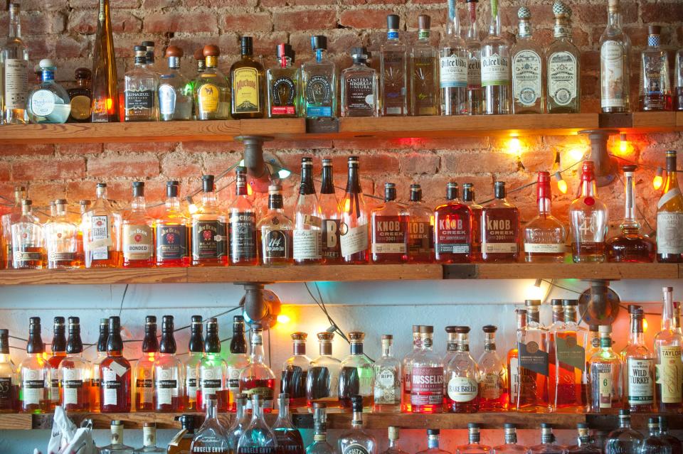 Bottles of liquor stack along the wall of the Silver Dollar Bar and Restaurant's long wood bar.September 04, 2018
