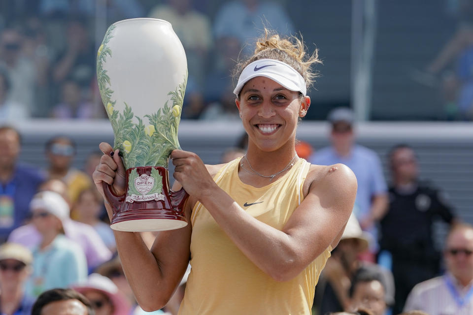 Madison Keys, of the United States, holds the Rookwood Cup after defeating Svetlana Kuznetsova, of Russia, in the women's final match during the Western & Southern Open tennis tournament Sunday, Aug. 18, 2019, in Mason, Ohio. (AP Photo/John Minchillo)