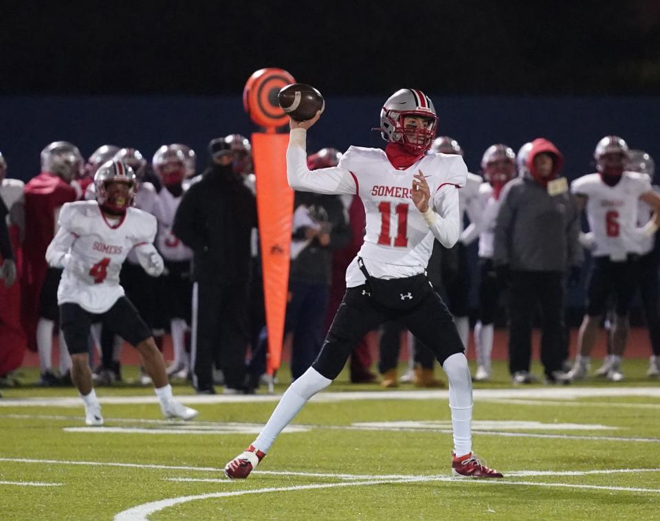 Somers' Matt Fitzsimons (11) makes a pass during the Class A state quarterfinal football game against Lourdes at Middletown High School in Middletown on Friday, November 18, 2022.