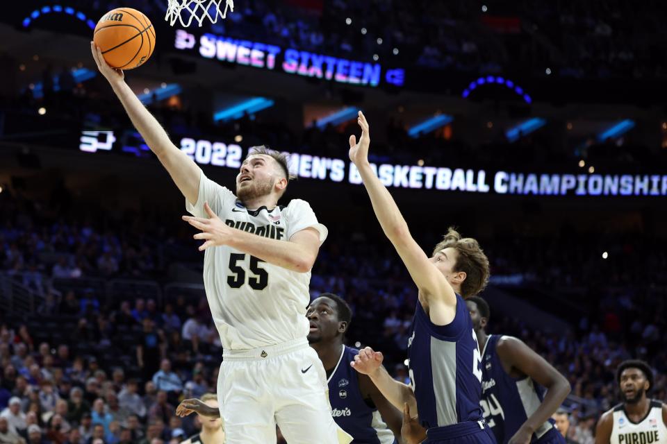 Mar 25, 2022; Philadelphia, PA, USA; Purdue Boilermakers guard Sasha Stefanovic (55) shoots against St. Peter's Peacocks guard Doug Edert (25) in the first half in the semifinals of the East regional of the men's college basketball NCAA Tournament at Wells Fargo Center. Mandatory Credit: Bill Streicher-USA TODAY Sports