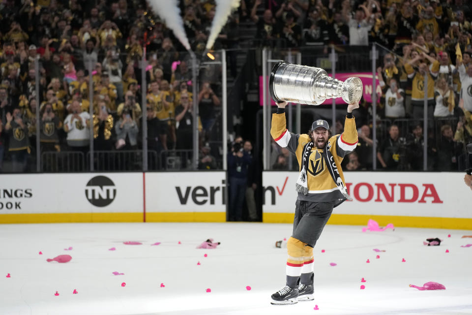 Vegas Golden Knights right wing Mark Stone hoists the Stanley Cup after the Knights defeated the Florida Panthers 9-3 in Game 5 of the NHL hockey Stanley Cup Finals Tuesday, June 13, 2023, in Las Vegas. The Knights won the series 4-1. (AP Photo/John Locher)