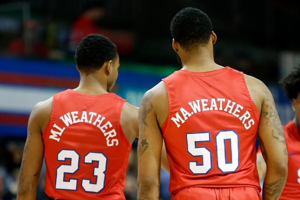 Feb 20, 2022; Dallas, Texas, USA; Southern Methodist Mustangs guard Michael Weathers (23) and forward Marcus Weathers (50) on the court before the game against the Memphis Tigers at Moody Coliseum. Mandatory Credit: Tim Heitman-USA TODAY Sports