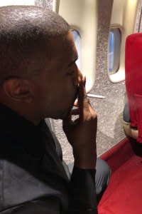 Kanye West enjoying a cigarette in what was once the norm on airplanes.