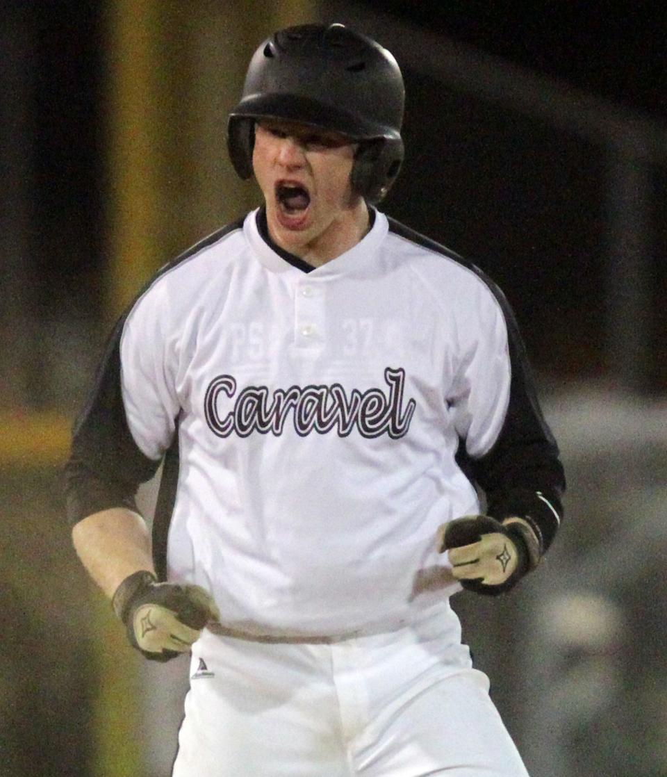 Caravel's Jake Fraley celebrates a fifth- inning RBI double vs. St. Mark's in 2013.