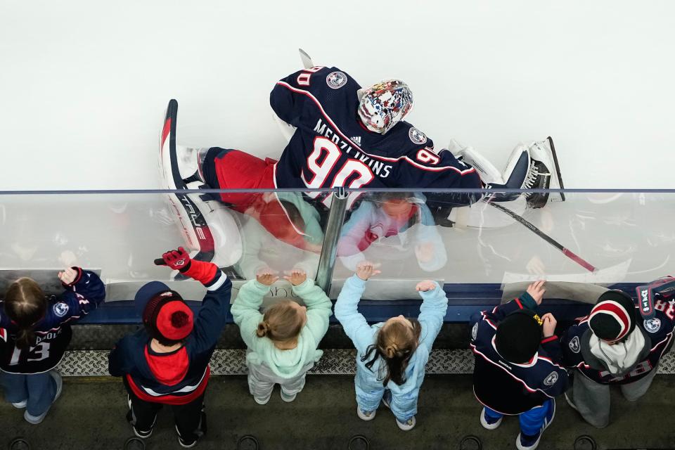 Jan 2, 2024; Columbus, Ohio, USA; Columbus Blue Jackets goaltender Elvis Merzlikins (90) stretches prior to the NHL hockey game against the Boston Bruins at Nationwide Arena.