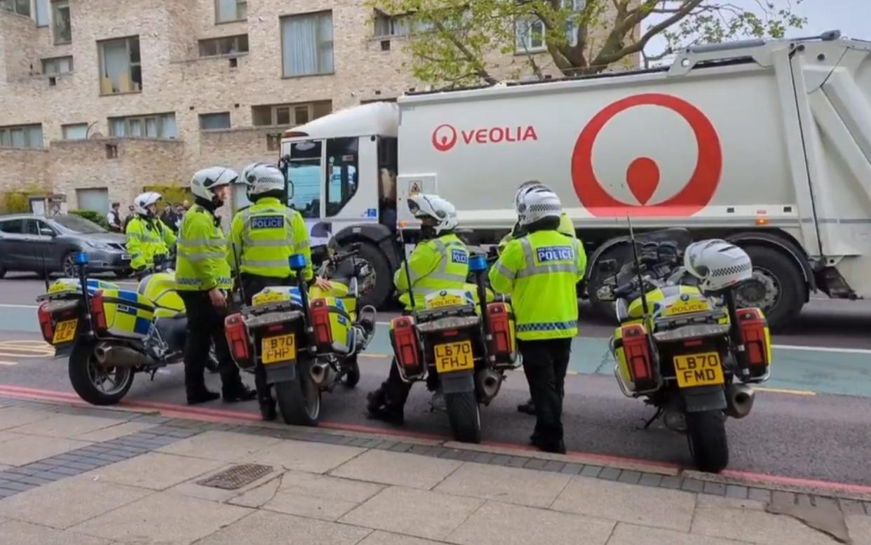 Officers are in the area, as people surround a coach in Peckham that they are claiming will be used to move illegal immigrants to the Bibby Stockholm barge
