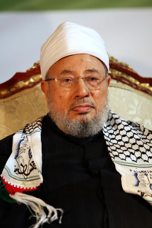 FILE PHOTO: Qatar's Egyptian-born cleric Sheikh Youssef al-Qaradawi attends a protest against Israel in Doha