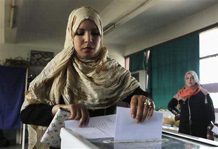 A woman casts her ballot during the presidential election in Algiers April 17, 2014. REUTERS/Louafi Larbi