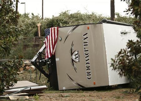 A camper sits on its side after a tornado came the Doss Ferry subdivision in Kimberly, Alabama, April 29, 2014. REUTERS/Tami Chappelll