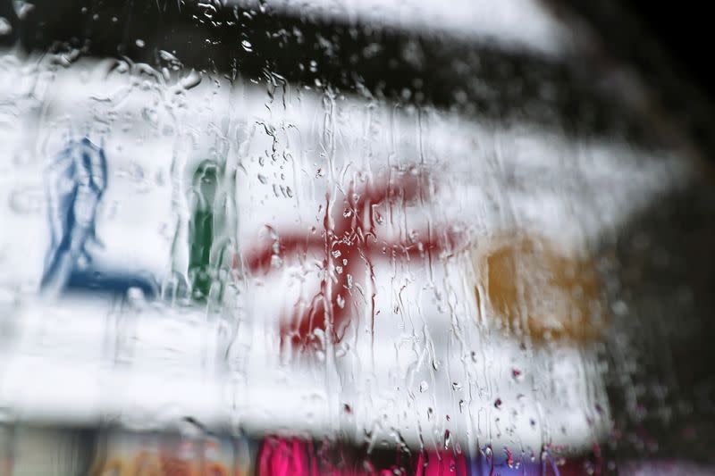 The Life Science Centre, which is being prepared as a mass coronavirus disease (COVID-19) vaccination hub, is seen through a window covered with rain, in Newcastle