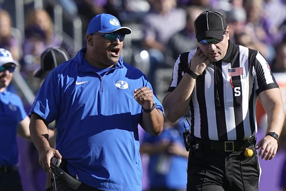 BYU head coach Kalani Sitake, left, yells at an official, right, during the second half of an NCAA college football game against TCU, Saturday, Oct. 14, 2023, in Fort Worth, Texas. | LM Otero, Associated Press