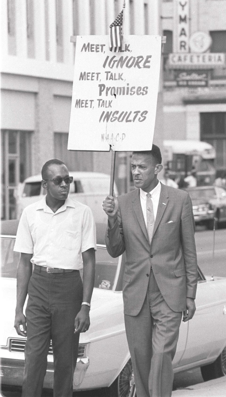 Rutledge Pearson (holding sign) leads a protest march in Jacksonville in 1966. (File/Florida Times-Union)