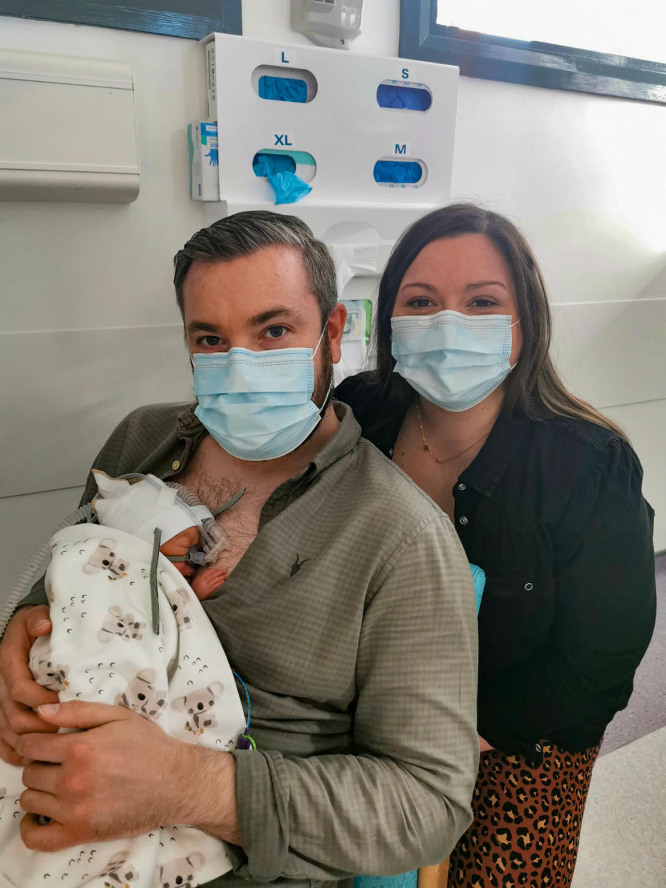 Martin and Gillian Johnston and their son Robbie in their first family photo taken in hospital (Johnston family/PA)