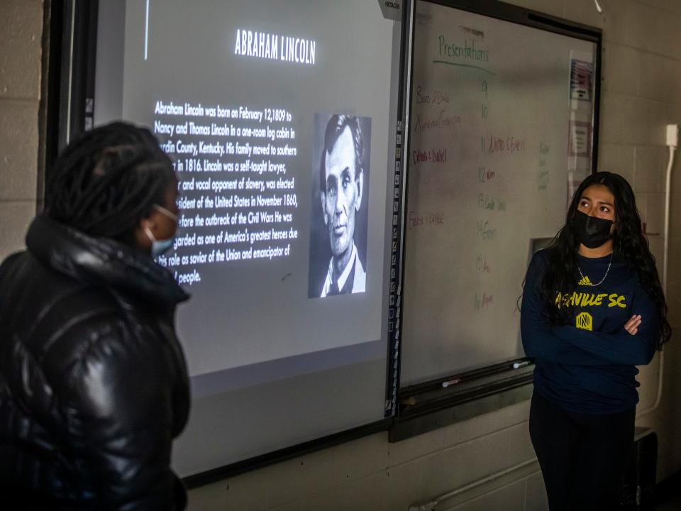 Emarie Hill, left, and Kaylee Velasquez present information about the Civil War at Glencliff High School Nov. 29.