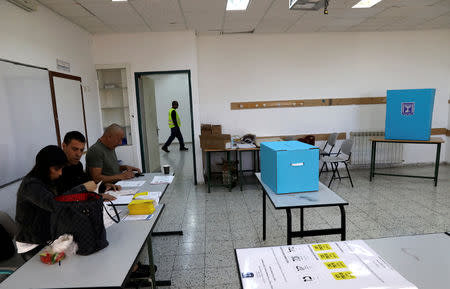 Election officials work inside a municipal polling station at Majdal Shams, in Israeli-occupied Golan Heights, October 30, 2018 REUTERS/Ammar Awad