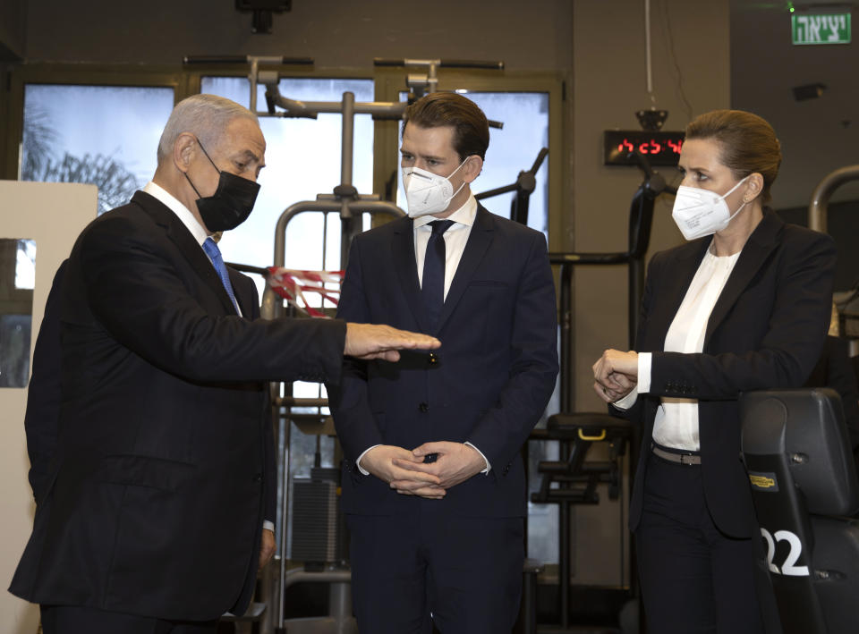 Israeli Prime Minister Benjamin Netanyahu, left, visits a fitness gym with Austrian Chancellor Sebastian Kurz, center, and Danish Prime Minister Mette Frederiksen, to observe how the "Green Pass," for citizens vaccinated against COVID-19, is used, in Modi'in, Israel, Thursday, March 4, 2021. Frederiksen and Kurz are on a short visit to Israel for to pursue the possibilities for closer cooperation on COVID-19 and vaccines. (Avigail Uzi/Pool via AP)