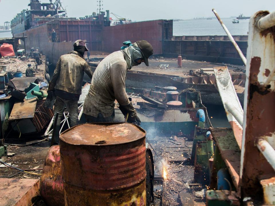 Workers destroyed the vessel to recycle precious steel in the yard of the ship in Cilincing on September 3, 2017 in Cilincing, Jakarta, Indonesia.