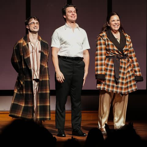 <p>John Nacion/Shutterstock</p> Daniel Radcliffe, Jonathan Groff and Lindsay Mendez in between bows at the opening night of the Broadway revival of 'Merrily We Roll Along' in October 2023