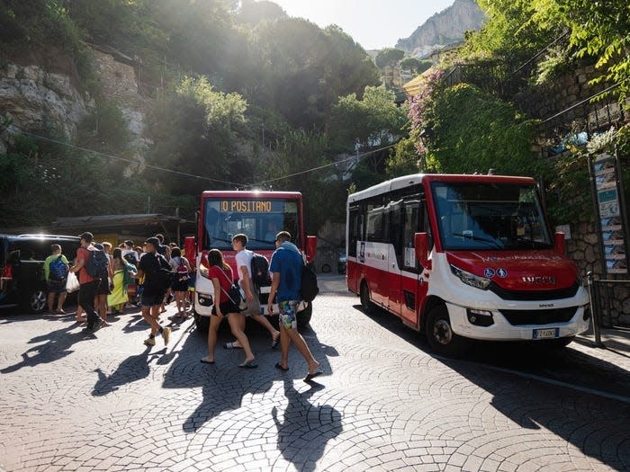 Tourists getting off buses in Positano.