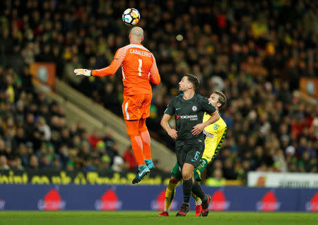 Soccer Football - FA Cup Third Round - Norwich City vs Chelsea - Carrow Road, Norwich, Britain - January 6, 2018 Chelsea's Willy Caballero heads clear of Danny Drinkwater and Norwich City's James Maddison Action Images via Reuters/John Sibley