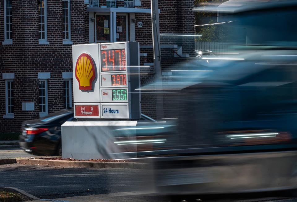 (FILES) In this file photo taken on November 23, 2021, a truck drives past a price board at a Shell gas station in Alexandria, Virginia1. - US consumer prices continued to surge in November, climbing 6.8 percent compared to the same month in 2020, the biggest jump since June 1982, the government said on December 10, 2021.