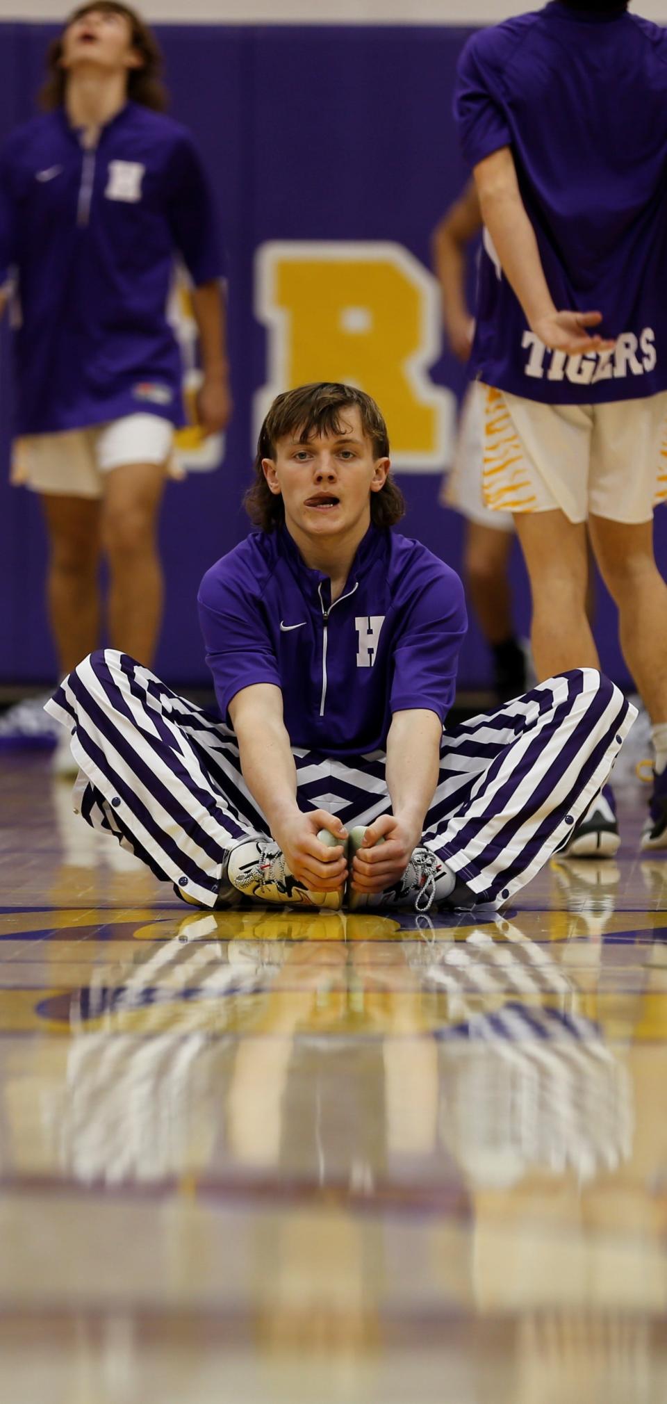 Hagerstown junior Mason Romack stretches during warmups before a game against Centerville Jan. 7, 2022, in the Wayne County Tournament.