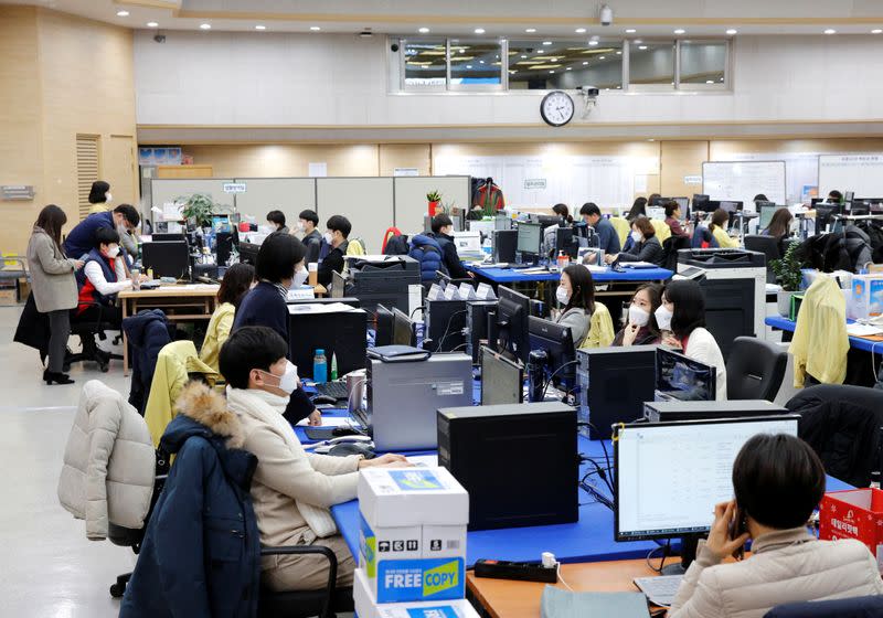 City employees work at Incheon city’s coronavirus response command center in Incheon