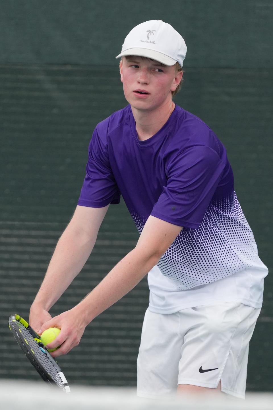 Curtis Sneden of Watertown prepares to serve during one of his first flight singles mataches during the opening day of the state Class AA high school boys tennis tournament on Thursday, May 16, 2024 at Rapid City.