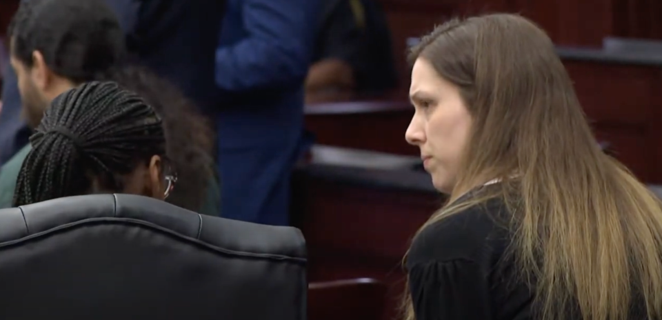 Shanna Gardner, right, leans over to one of her attorneys as she learns their bond motion was denied Friday. She and husband Mario Fernandez Saldana, top left, are charged in the murder-for-hire shooting death of her ex, Jared Bridegan, in Jacksonville Beach.