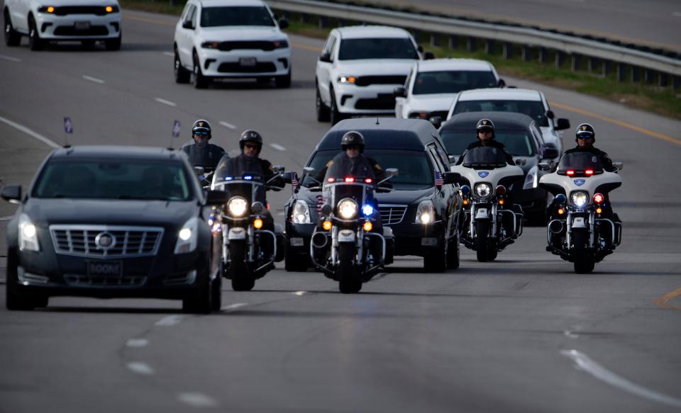 Vanderburgh County Sheriff's Deputy Asson Anthony Hacker's funeral procession moves through the streets of Evansville to Christian Fellowship Church for his visitation and funeral Thursday morning, March 9, 2023. Hacker was going through basic training March 2 when he became ill, lost consciousness and died, according to Sheriff Noah Robinson. 