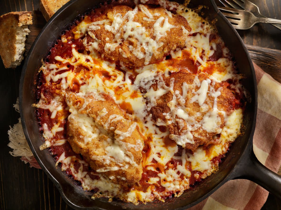 Baked Chicken Parmesan in a black cast iron pan