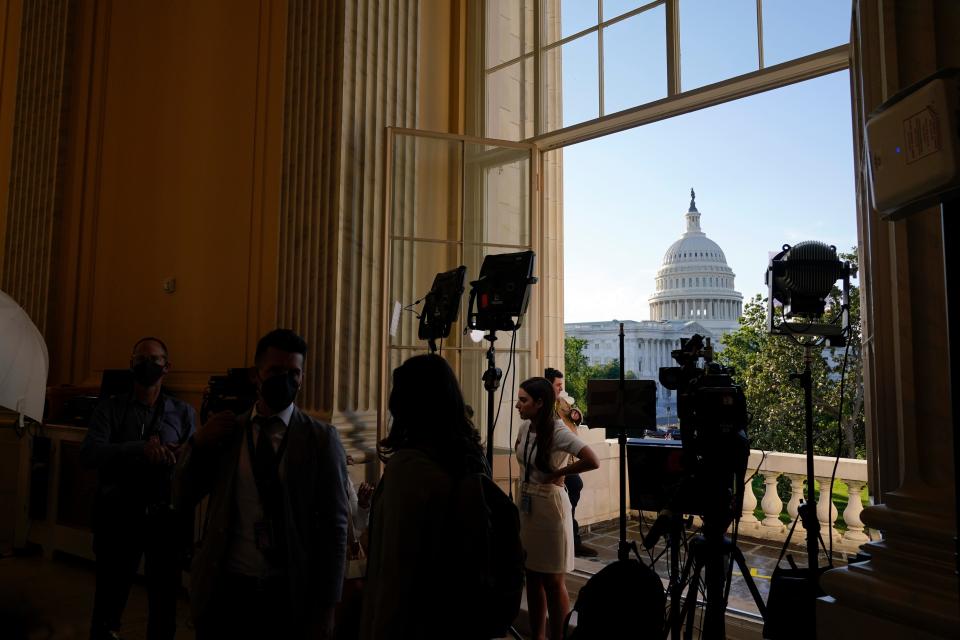 Members of the media gather on Capitol Hill as the House select committee investigating the Jan. 6 attack on the U.S. Capitol prepares to hold its first public hearing to reveal the findings of a year-long investigation, Thursday, June 9, 2022, in Washington.