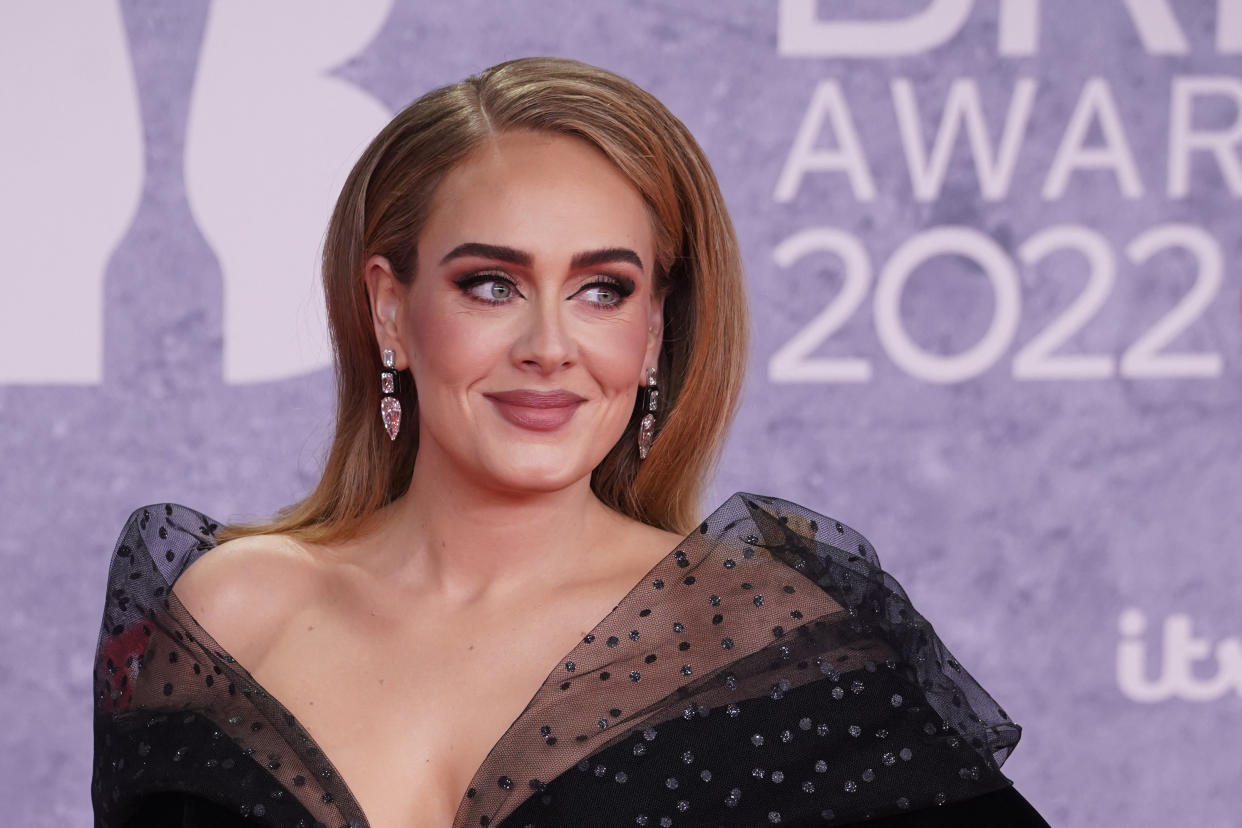 British singer Adele Laurie Blue Adkins aka Adele poses on the red carpet upon her arrival for the BRIT Awards 2022 in London on February 8, 2022. - RESTRICTED TO EDITORIAL USE  NO POSTERS  NO MERCHANDISE NO USE IN PUBLICATIONS DEVOTED TO ARTISTS (Photo by Niklas HALLE'N / AFP) / RESTRICTED TO EDITORIAL USE  NO POSTERS  NO MERCHANDISE NO USE IN PUBLICATIONS DEVOTED TO ARTISTS (Photo by NIKLAS HALLE'N/AFP via Getty Images)