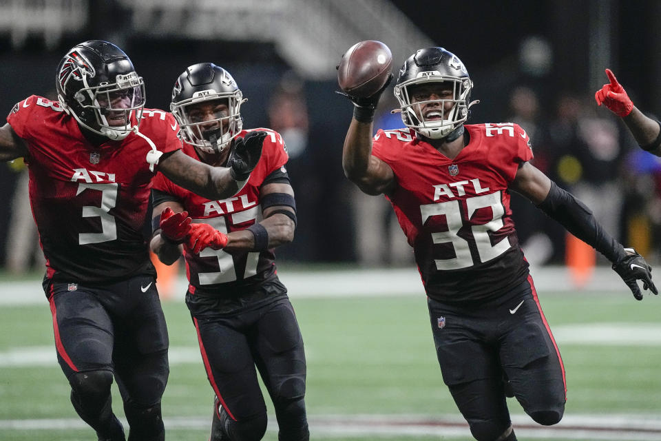 Atlanta Falcons safety Jaylinn Hawkins (32) celebrates his interception against the Chicago Bears during the second half of an NFL football game, Sunday, Nov. 20, 2022, in Atlanta. The Atlanta Falcons won 27-24. (AP Photo/John Bazemore)