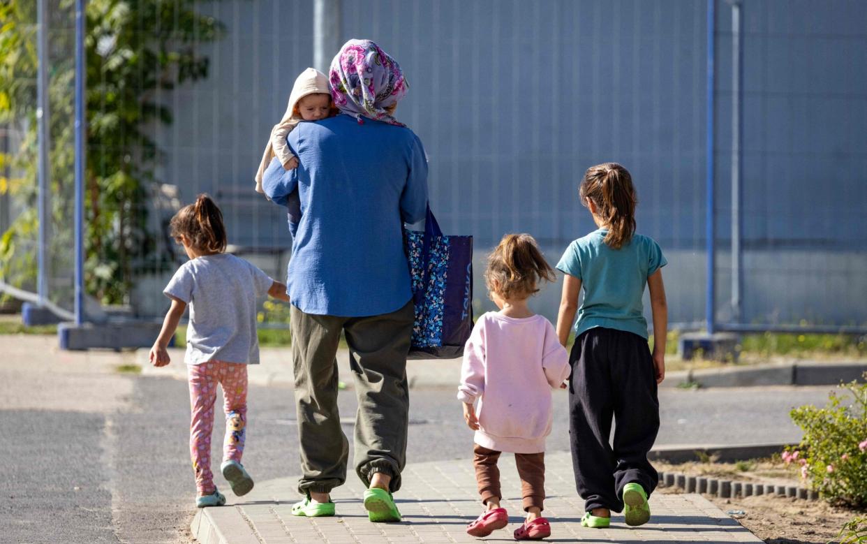 A family of migrants in Germany - Germany to reduce migrant benefits to 'bed, bread and soap'