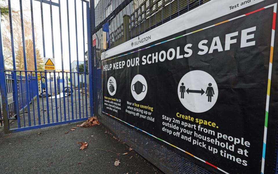 A sign outside St Joseph's RC Primary School in Highgate, north London, - Yui Mok/PA