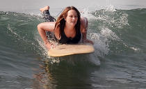 <p>Leighton Meester catches waves at the beach in Malibu on Thursday.</p>