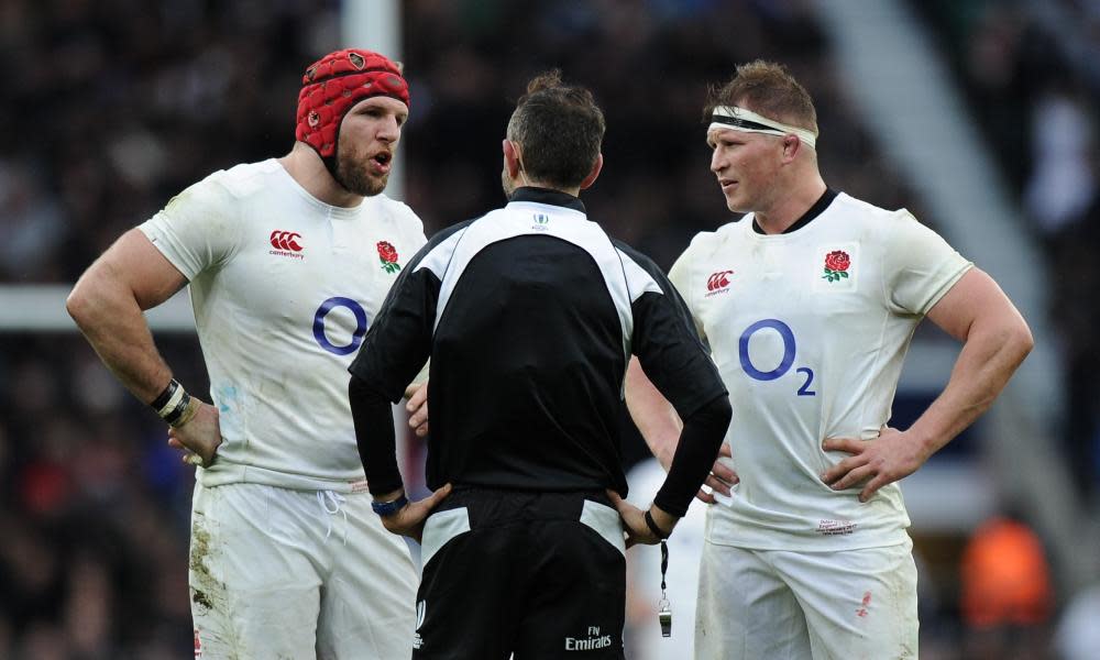 James Haskell, left, and his captain Dylan Hartley discuss the Italian breakdown tactic with the referee Romain Poite at Twickenham.