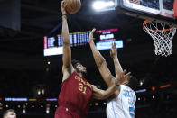 Cleveland Cavaliers center Jarrett Allen (31) shoots against Charlotte Hornets forward Grant Williams (2) during the first half of an NBA basketball game, Monday, March 25, 2024, in Cleveland. (AP Photo/Ron Schwane)