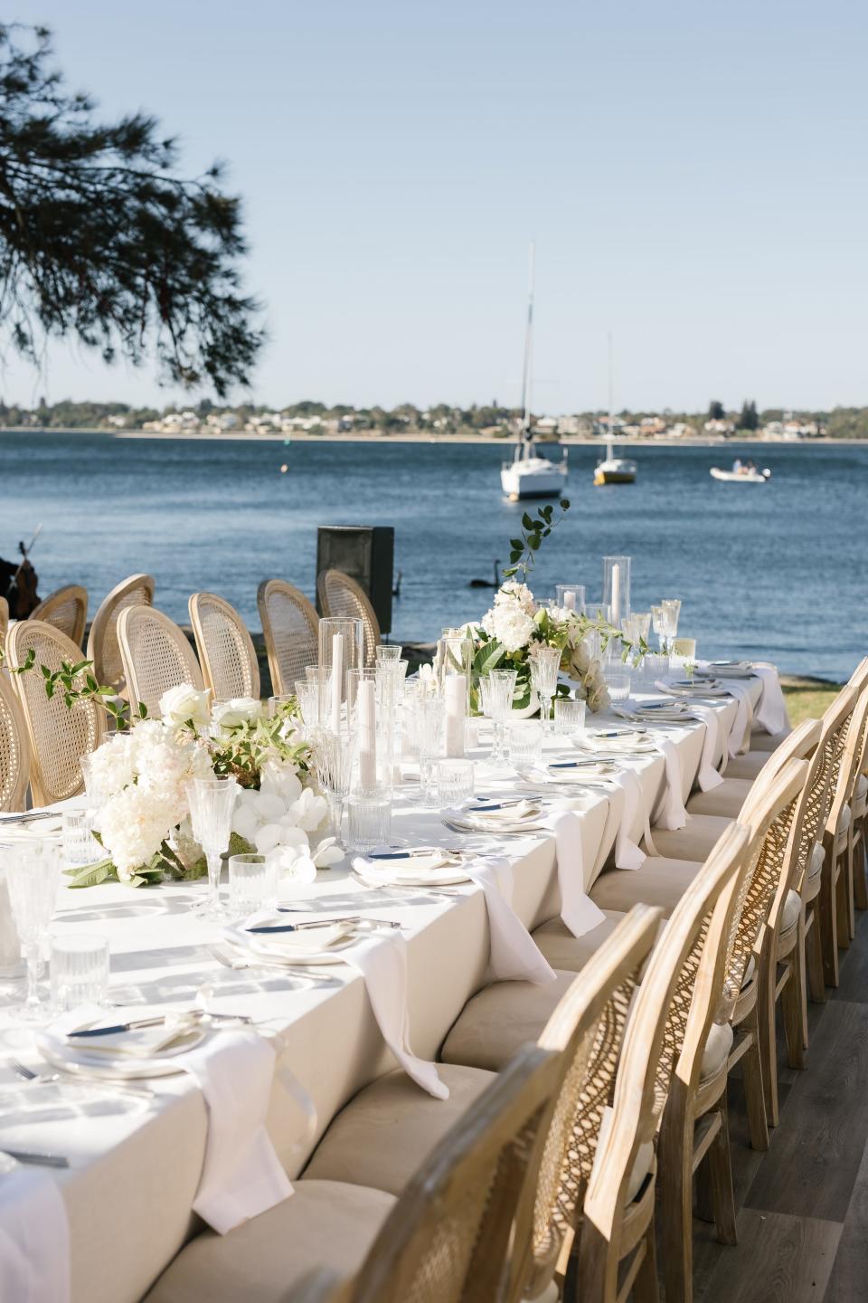 A table overlooks a body of water.