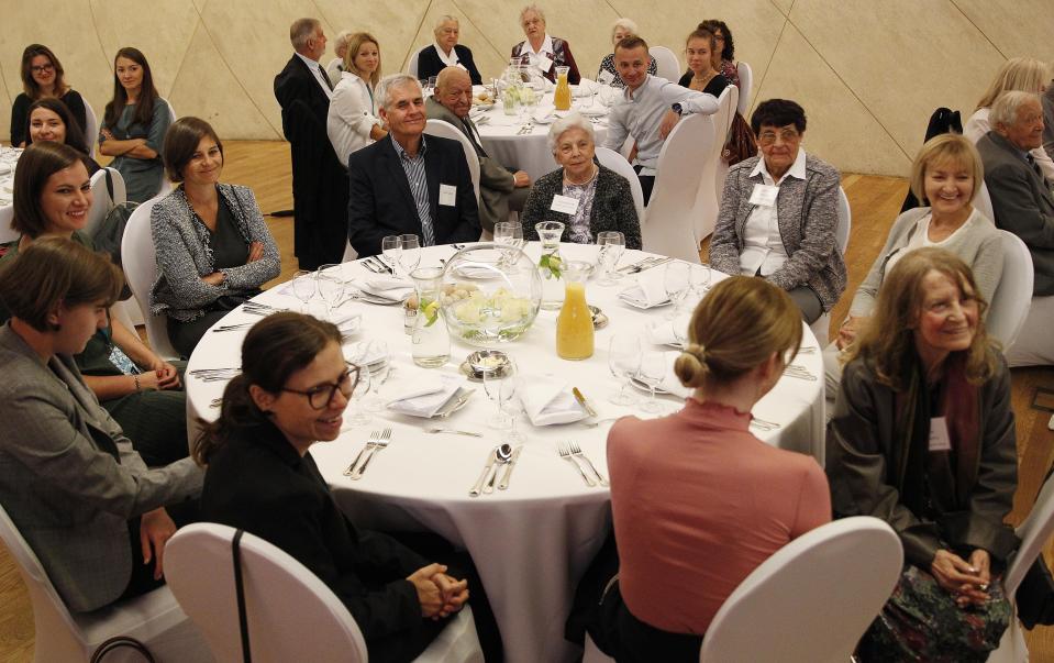 Polish people who saved Jews during WWII sit with family members and others during an event to honor them, in Warsaw, Poland, Sunday, Sept. 8, 2019. A U.S.-based Jewish foundation held an event in Warsaw on Sunday to honor Polish gentiles who rescued Jews during the Holocaust, a number that grows smaller each year, with U.S. and Israeli diplomats also paying their respects to the elderly Poles who put their lives in danger to save others. (AP Photo/Czarek Sokolowski)