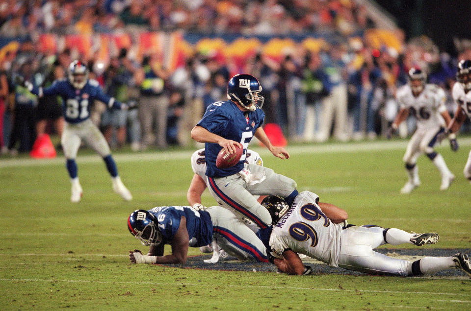 Baltimore Ravens defensive end Michael McCrary sacks New York Giants quarterback Kerry Collins during Super Bowl XXXV on Jan. 28, 2001.<span class="copyright">John Iacono—Sports Illustrated/Getty Images</span>