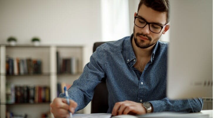 A man looks over his finances. 