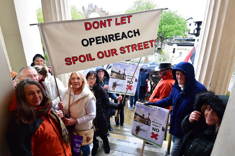 Residents protest outside Southport Town Hall over Openreach poles installations in the town.